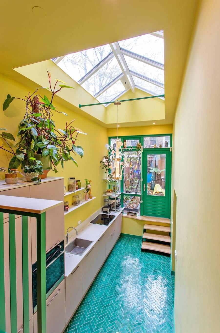 The 2026 Home Decor and Color Trends, According to Pinterest 26 kitchen with yellow walls blue floor tiles and light pink cabinets nordroom