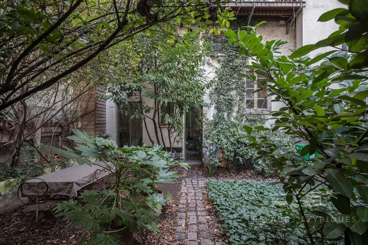 Spectacular Windows In A Serene Book-Filled Oasis in Paris 3 book filled oasis paris nordroom1 Spectacular Windows In A Serene Book-Filled Oasis in Paris