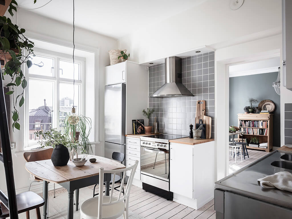 A Charming Swedish Apartment with Blue Walls and Plants 11 small blue scandinavian apartment nordroom10 A Charming Swedish Apartment with Blue Walls and Plants