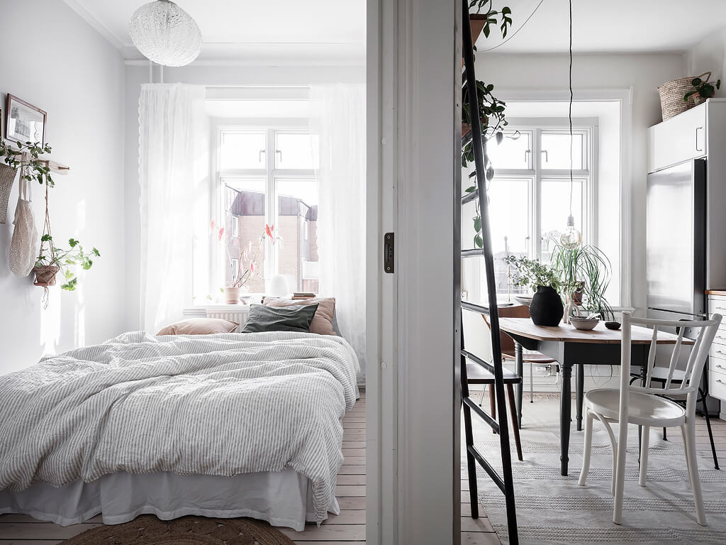 A Charming Swedish Apartment with Blue Walls and Plants 12 small blue scandinavian apartment nordroom11 A Charming Swedish Apartment with Blue Walls and Plants