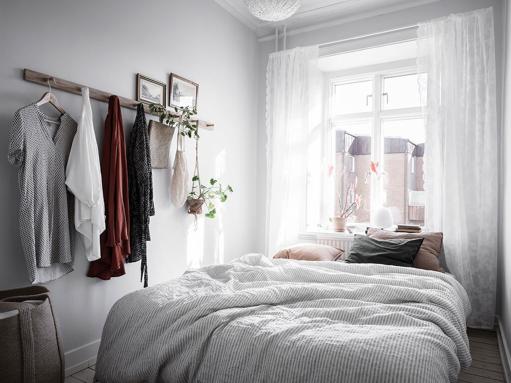 A Charming Swedish Apartment with Blue Walls and Plants 13 small blue scandinavian apartment nordroom12 A Charming Swedish Apartment with Blue Walls and Plants