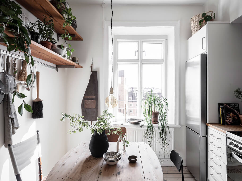 A Charming Swedish Apartment with Blue Walls and Plants 9 small blue scandinavian apartment nordroom8 A Charming Swedish Apartment with Blue Walls and Plants