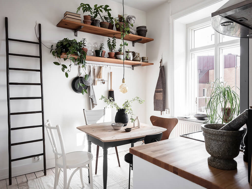 A Charming Swedish Apartment with Blue Walls and Plants 10 small blue scandinavian apartment nordroom9 A Charming Swedish Apartment with Blue Walls and Plants