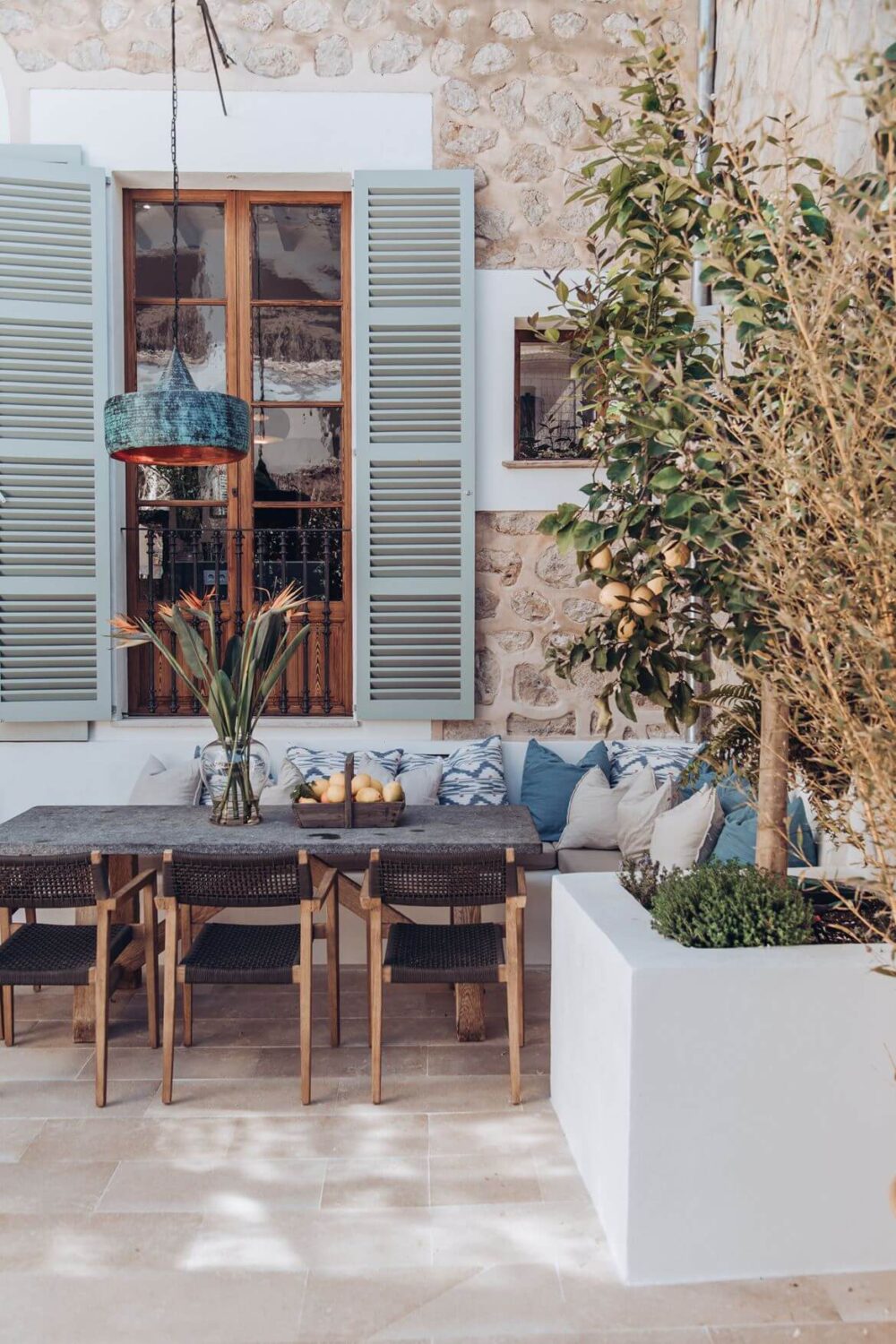 Valspar Color of the Year 2024: Renew Blue 39 light blue shutters garden dining space