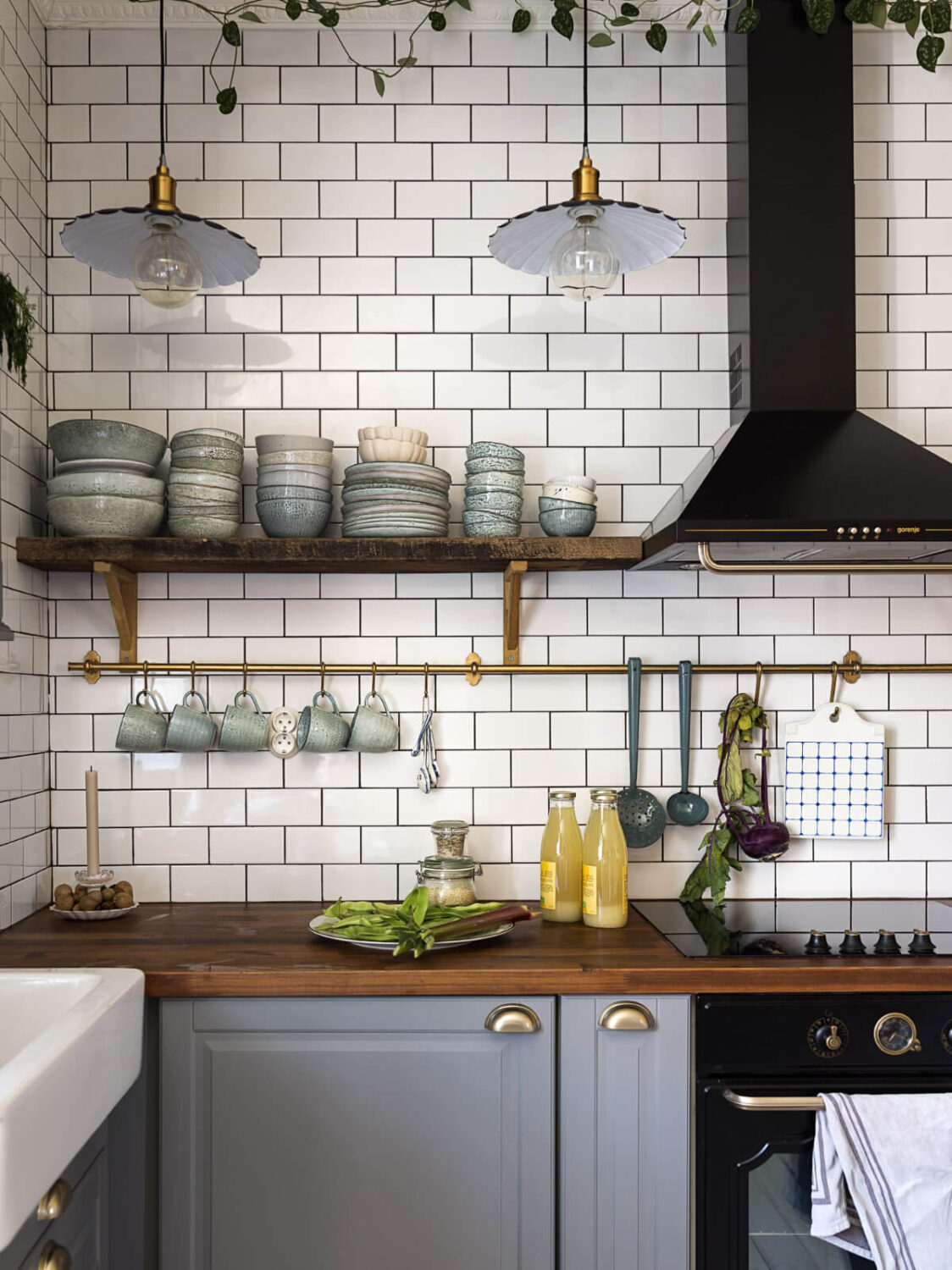 A Romantic Vintage Apartment in Stockholm 3 vintage style kitchen wooden shelf with brass rails