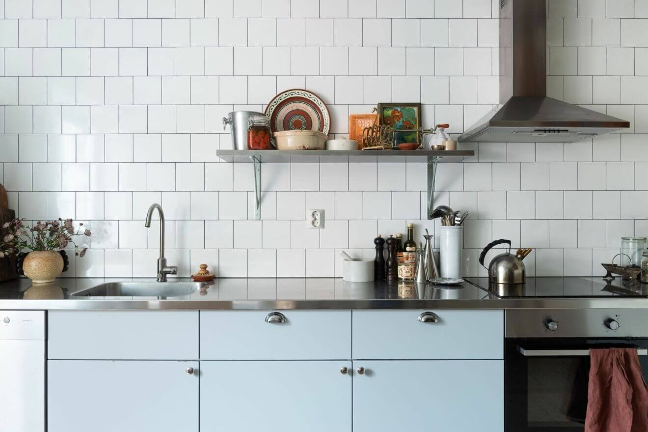 A Stockholm Apartment with Bohemian and Natural Touches 7 pastel blue kitchen A Stockholm Apartment with Bohemian and Natural Touches
