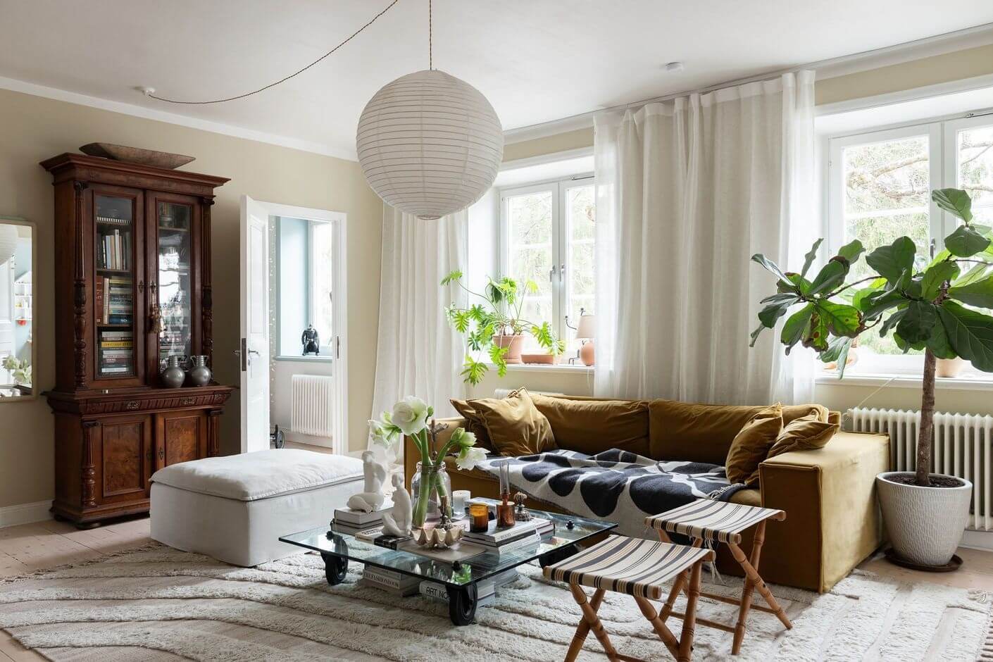 A Stockholm Apartment with Bohemian and Natural Touches 3 sofia wood living room A Stockholm Apartment with Bohemian and Natural Touches