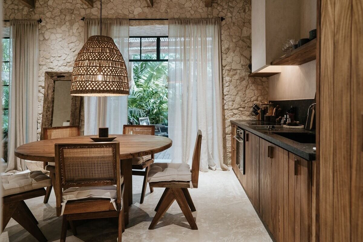 A Design SPA Apartment in Tulum Surrounded by Nature 10 wood-kitchen-large-round-dining-table-airbnb-tulum-nordroom