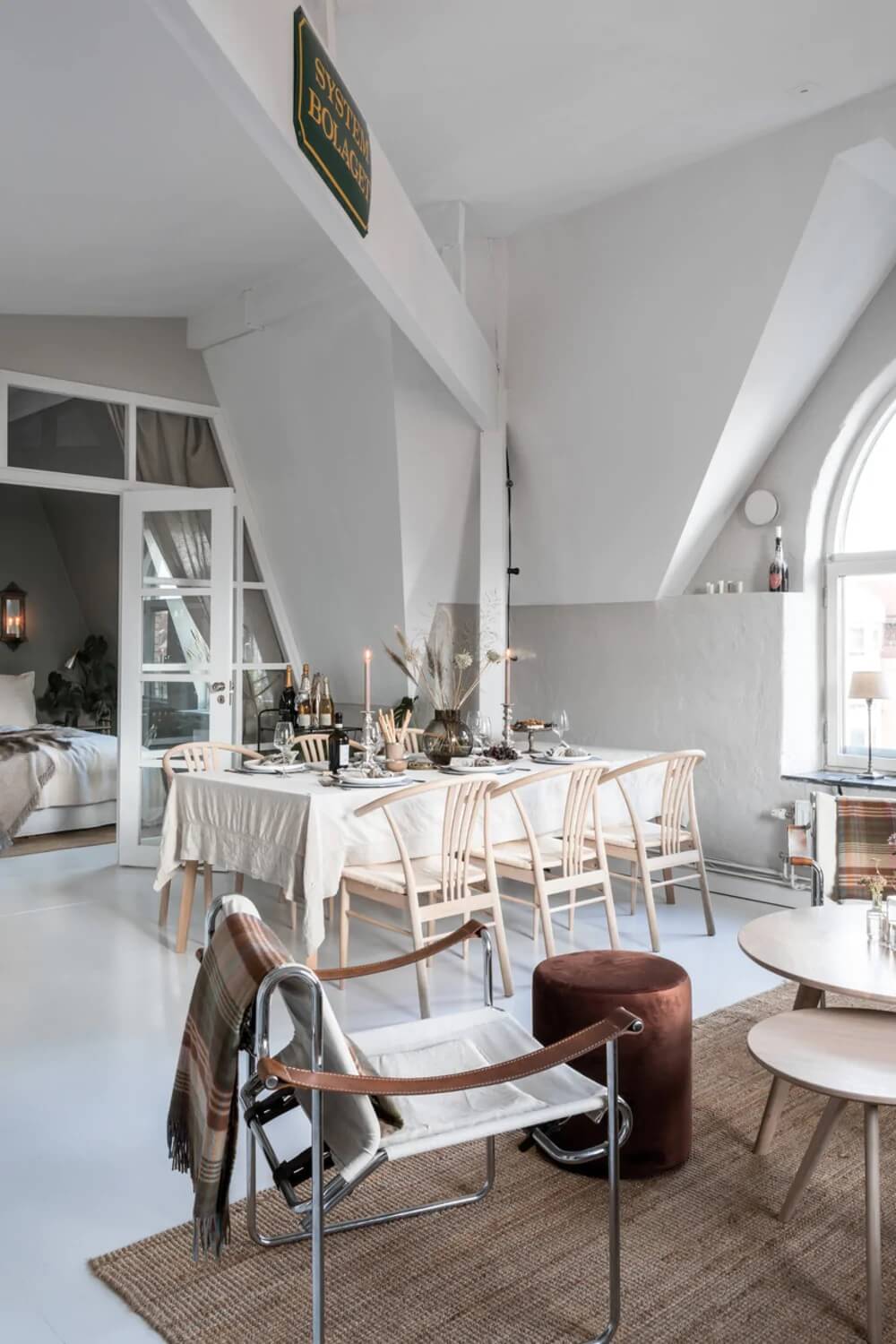 An Attic Apartment Turned Bright with White Paint and Glass Walls 1 bright attic apartmentg glass wall nordroom An Attic Apartment Turned Bright with White Paint and Glass Walls