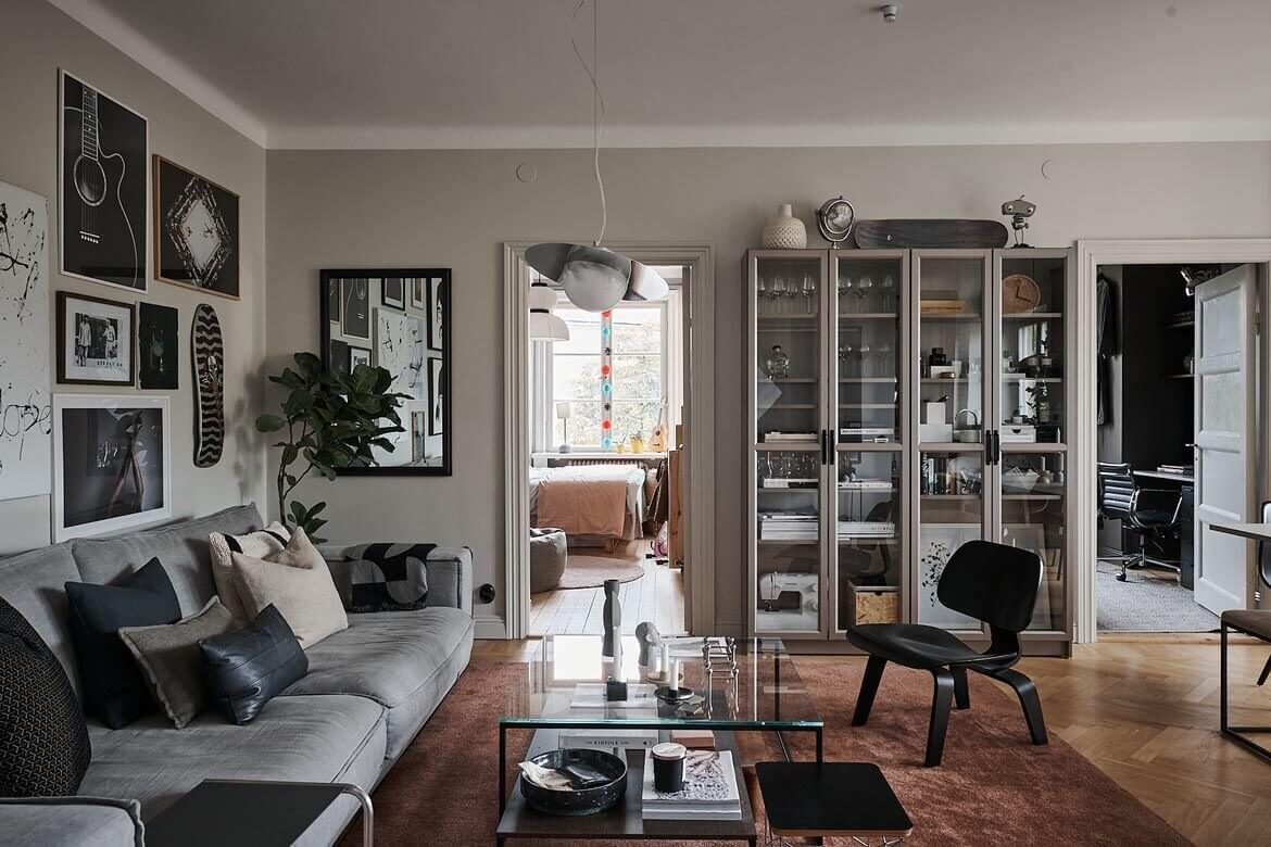 A Grey Scandinavian Apartment with Art-Filled Living Room 1 grey scandinavian apartment art nordroom A Grey Scandinavian Apartment with Art-Filled Living Room