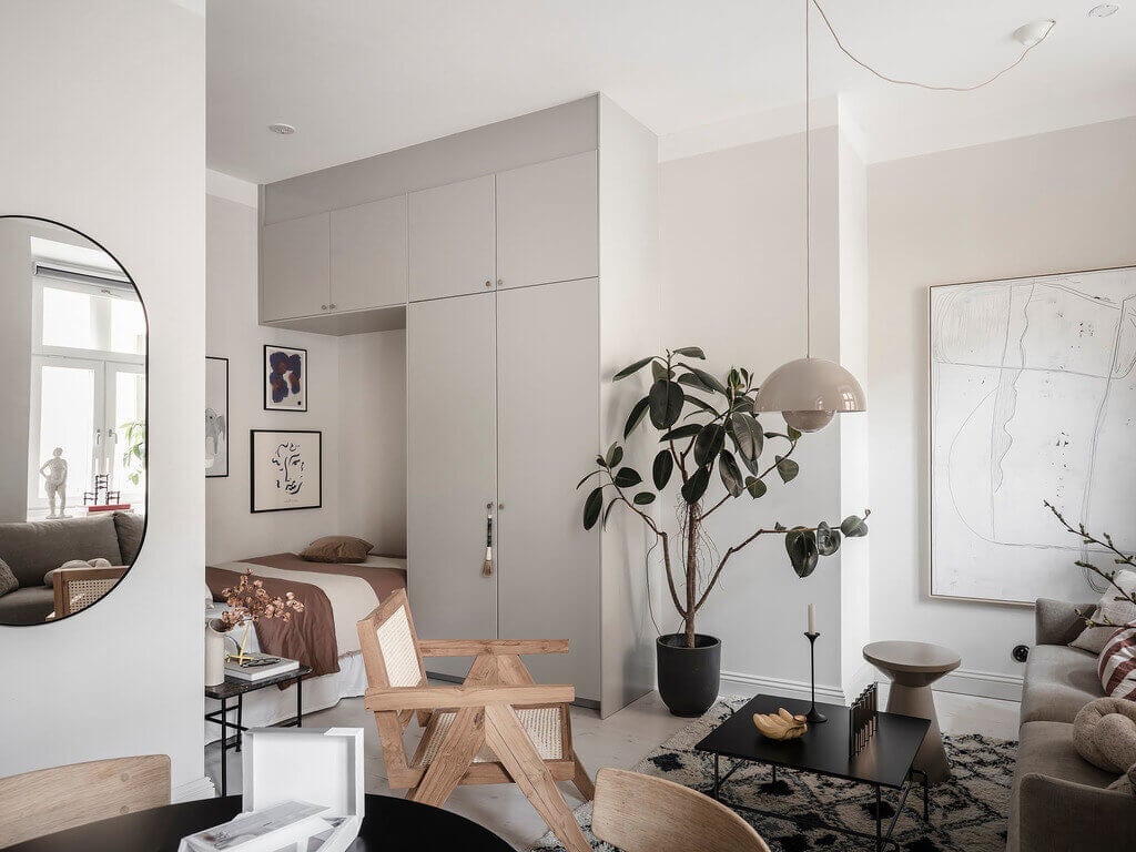 A Tiny Studio Apartment With A Storage-Filled Bed Nook 10 ATinyStudioApartmentWithAStorage FilledBedNook TheNordroom9 A Tiny Studio Apartment With A Storage-Filled Bed Nook