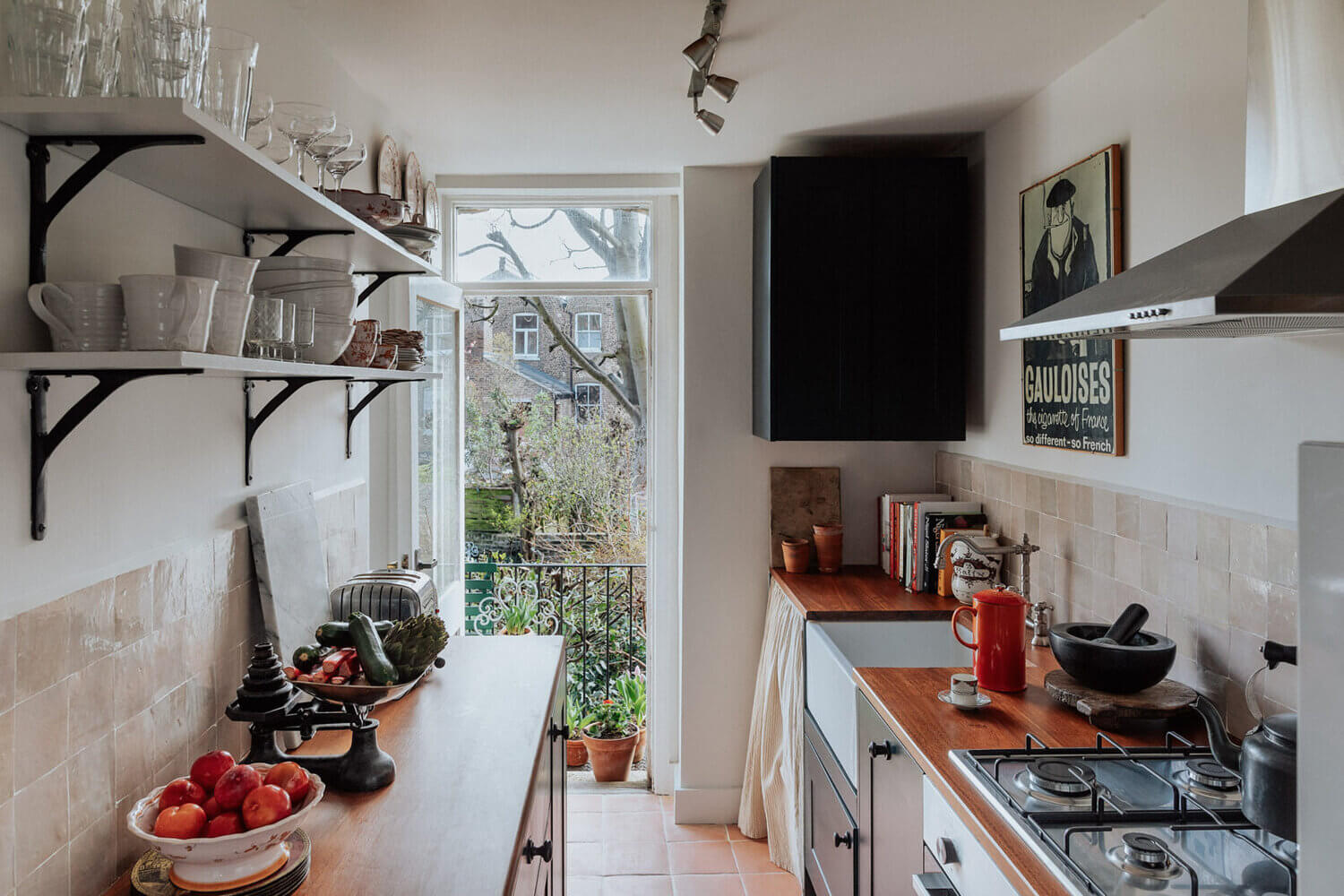 The Small London Apartment Of An Antiques Dealer 12 TinyBlueKitchenWithGardenViewsinaSmallLondonApartmentofanAntiquesDealer TheNordroom9 The Small London Apartment Of An Antiques Dealer