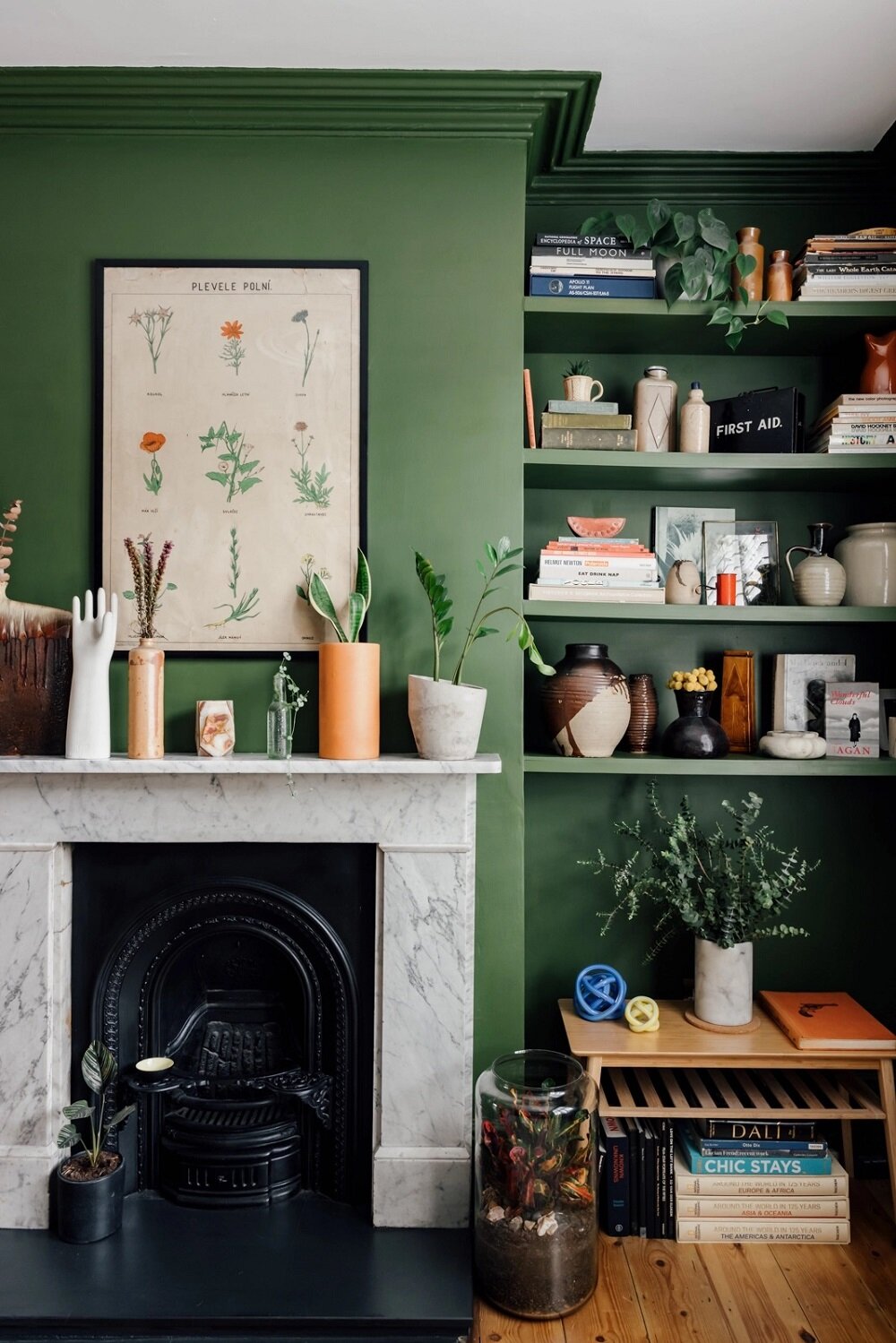A Colorful Family Home in London 4 green-living-room-bookshelves-fireplace-nordroom