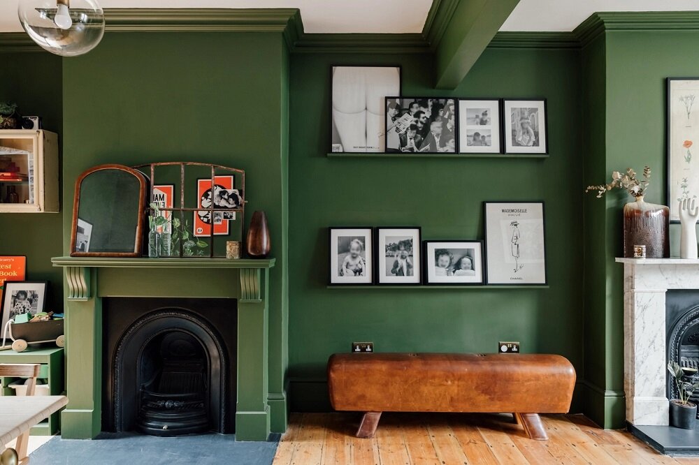 A Colorful Family Home in London 3 green-living-room-leather-bench-picture-ledge-fireplace-nordroom