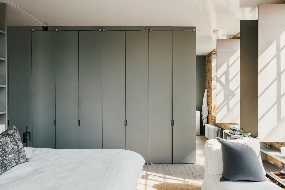 A London Loft Designed By Ilse Crawford And Vincent van Duysen 16 london-loft-ilse-crawford-vincent-van-duysen-grey-bookshelves-kitchen-island--zellige-tiles-brick-wall-victorian-warehouse-conversion-nordroom