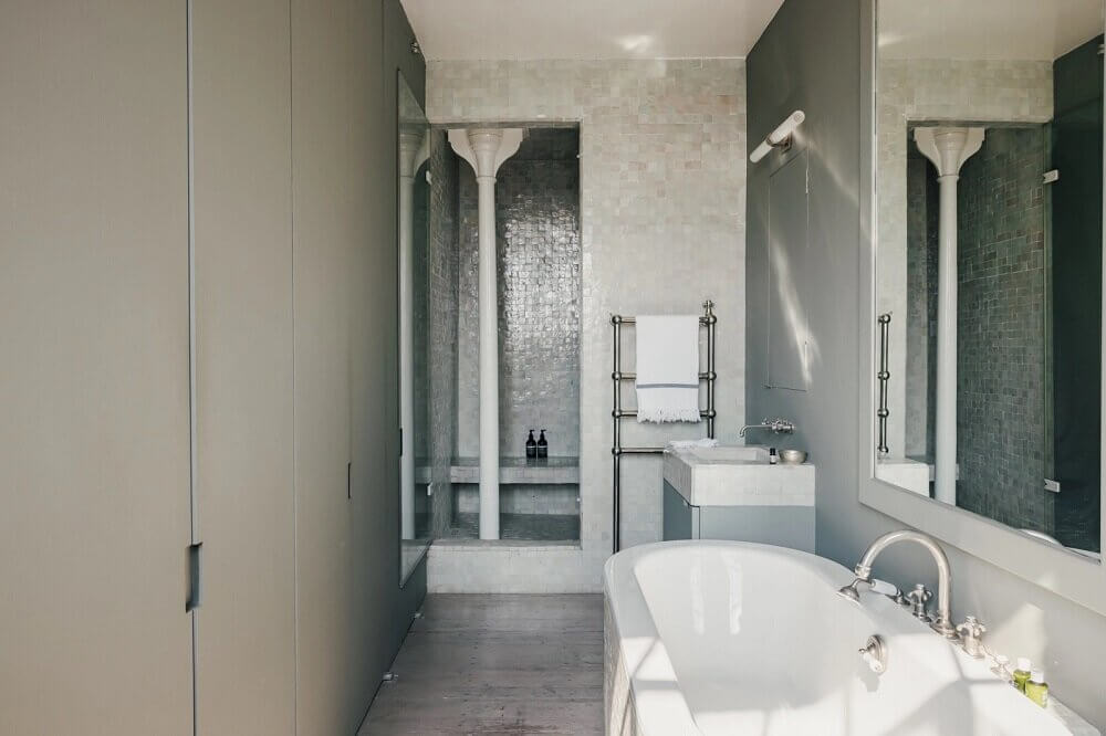 A London Loft Designed By Ilse Crawford And Vincent van Duysen 17 london-loft-ilse-crawford-vincent-van-duysen-grey-bookshelves-kitchen-island--zellige-tiles-brick-wall-victorian-warehouse-conversion-nordroom
