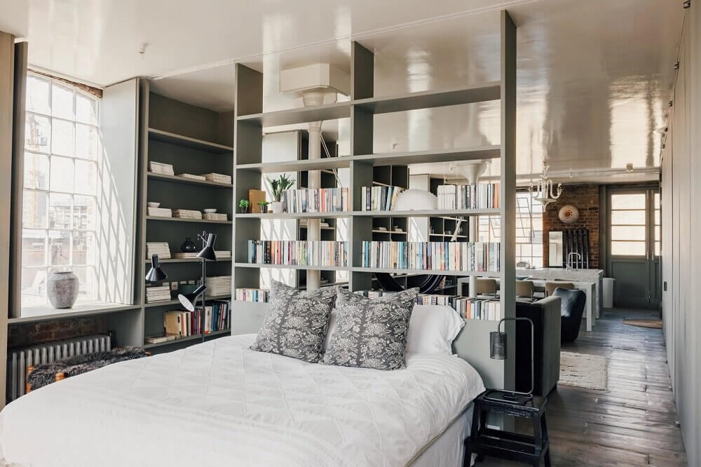 43 Ideas To Divide a Studio Apartment Into Multiple Rooms 69 london-loft-ilse-crawford-vincent-van-duysen-grey-bookshelves-kitchen-island--zellige-tiles-brick-wall-victorian-warehouse-conversion-nordroom