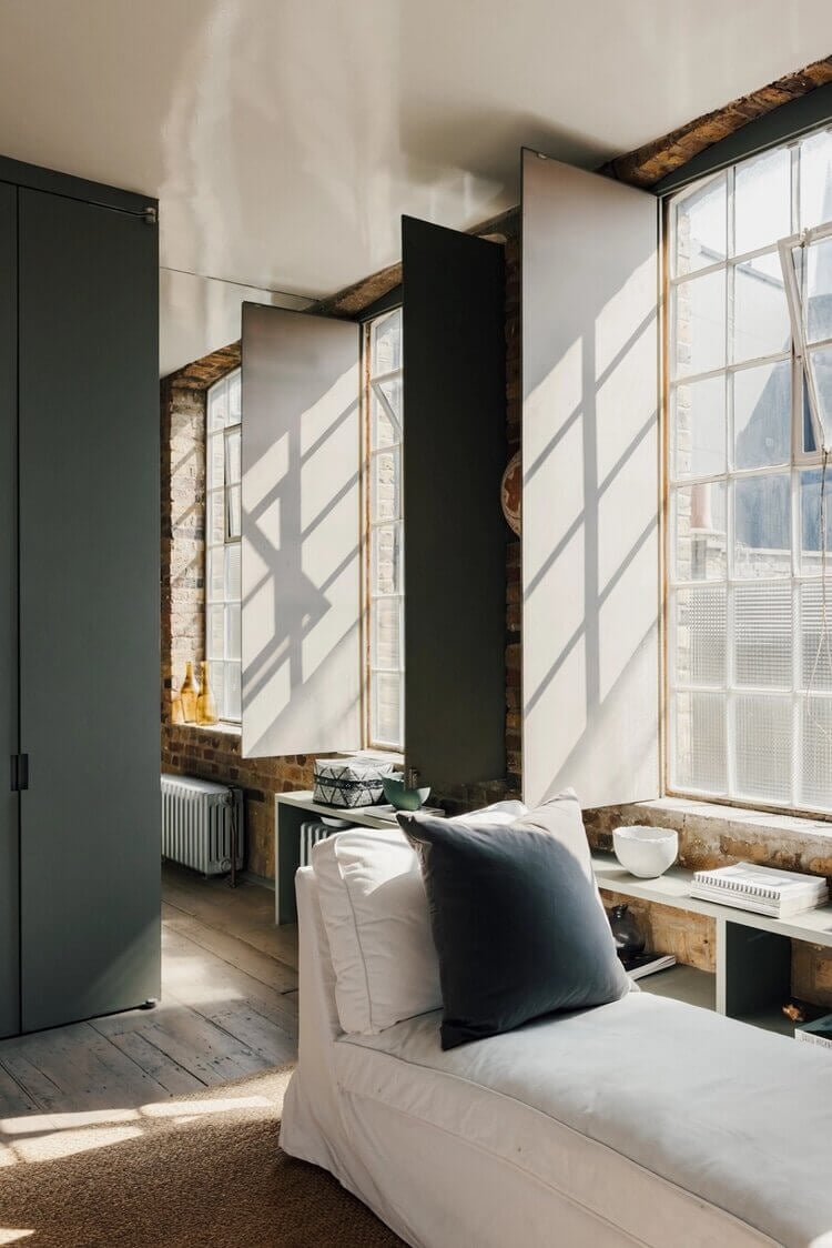A London Loft Designed By Ilse Crawford And Vincent van Duysen 14 london-loft-ilse-crawford-vincent-van-duysen-grey-bookshelves-kitchen-island--zellige-tiles-brick-wall-victorian-warehouse-conversion-nordroom