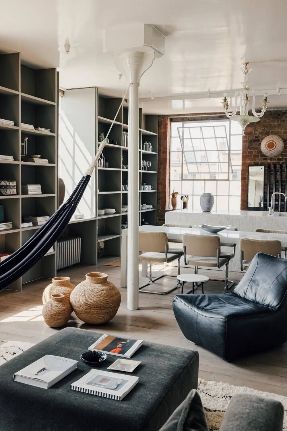 A London Loft Designed By Ilse Crawford And Vincent van Duysen 3 london-loft-ilse-crawford-vincent-van-duysen-grey-bookshelves-hammock-nordroom