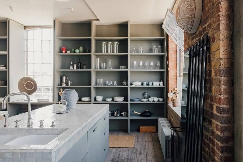 A London Loft Designed By Ilse Crawford And Vincent van Duysen 8 london-loft-ilse-crawford-vincent-van-duysen-grey-bookshelves-kitchen-island--zellige-tiles-brick-wall-victorian-warehouse-conversion-nordroom