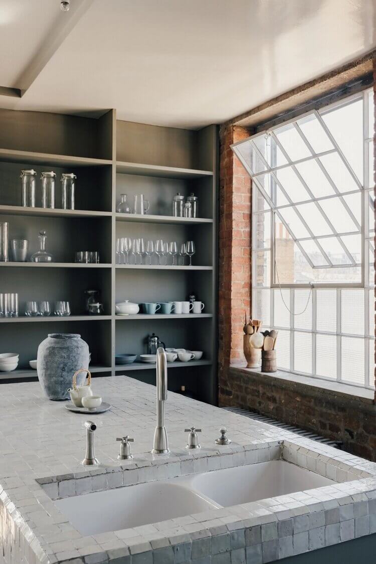 A London Loft Designed By Ilse Crawford And Vincent van Duysen 10 london-loft-ilse-crawford-vincent-van-duysen-grey-bookshelves-kitchen-island--zellige-tiles-brick-wall-victorian-warehouse-conversion-nordroom