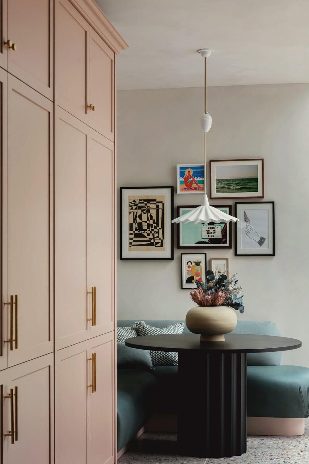 Warm Colors and Texture In A North London Family Home 8 pink-kitchen-breakfast-nook-blue-velvet-bench-round-table-studio-duggan
