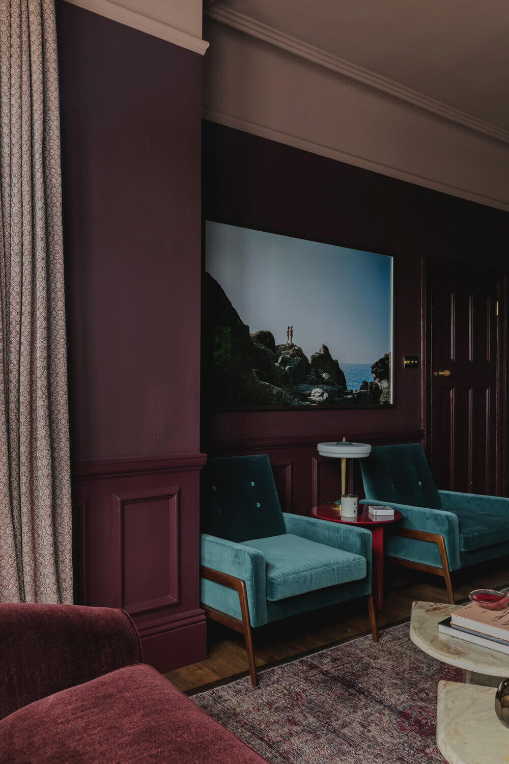Warm Colors and Texture In A North London Family Home 2 purple-living-room-blue-velvet-midcentury-armchair-london-studio-duggan-nordroom