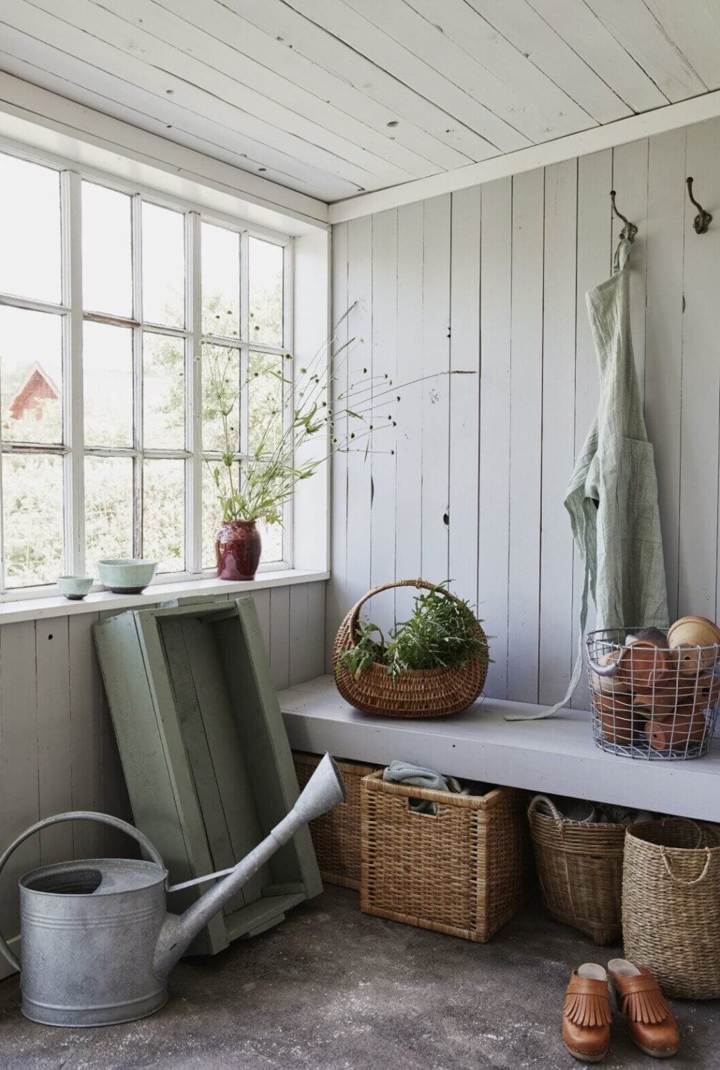 A Small Farmhouse-Style Cottage on a Swedish Allotment 7 wooden-bench-baskets-farmhouse-cottage-sweden-recycled-nordroom