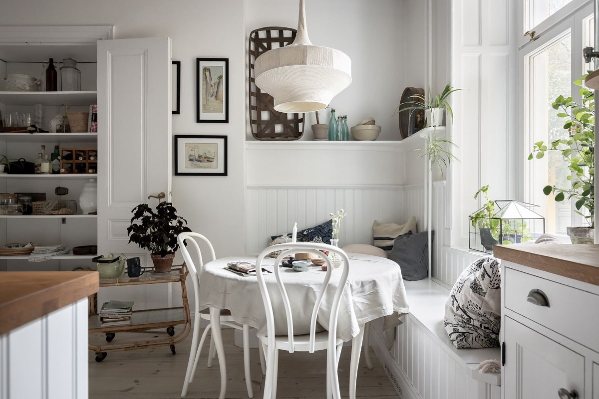 A Bright and Natural Scandinavian Apartment 13 white-kitchen-window-seat-bright-natural-scandinavian-apartment-period-details-nordroom