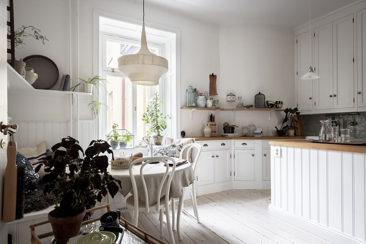A Bright and Natural Scandinavian Apartment 15 white-kitchen-window-seat-bright-natural-scandinavian-apartment-period-details-nordroom
