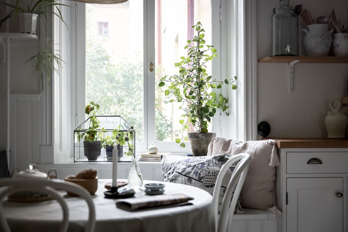 A Bright and Natural Scandinavian Apartment 16 white-kitchen-window-seat-bright-natural-scandinavian-apartment-period-details-nordroom