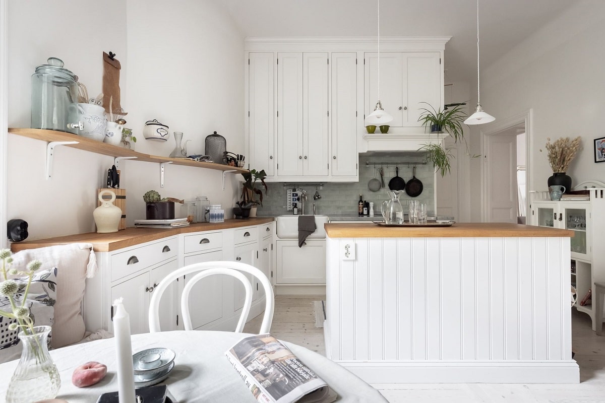 A Bright and Natural Scandinavian Apartment 18 white-kitchen-window-seat-bright-natural-scandinavian-apartment-period-details-nordroom