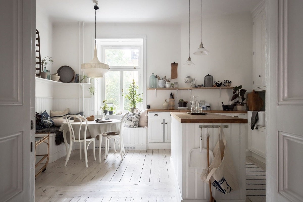 A Bright and Natural Scandinavian Apartment 11 white-kitchen-window-seat-bright-natural-scandinavian-apartment-period-details-nordroom
