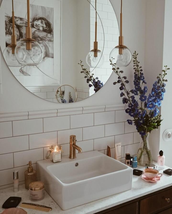 A Warm Scandinavian-Inspired Home in Poland 22 bathroom-sink-round-mirror-subway-tiles-nordroom