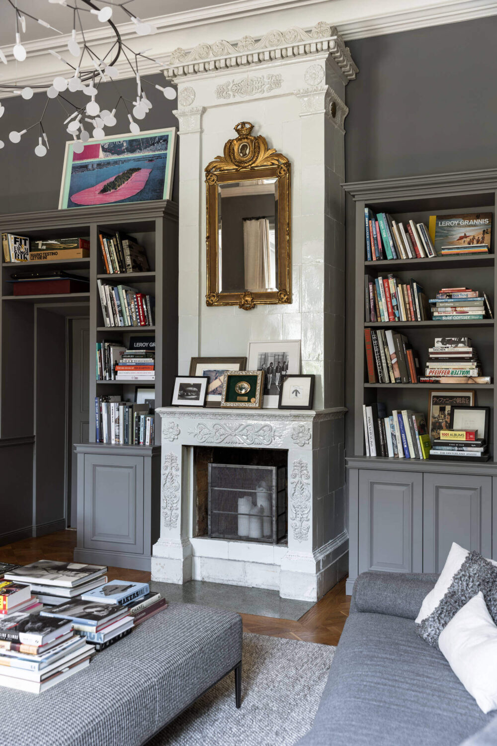 A Stylish Gray Apartment in a Swedish Castle 2 fireplace-bookshelves-gray-apartment-sweden-nordroom