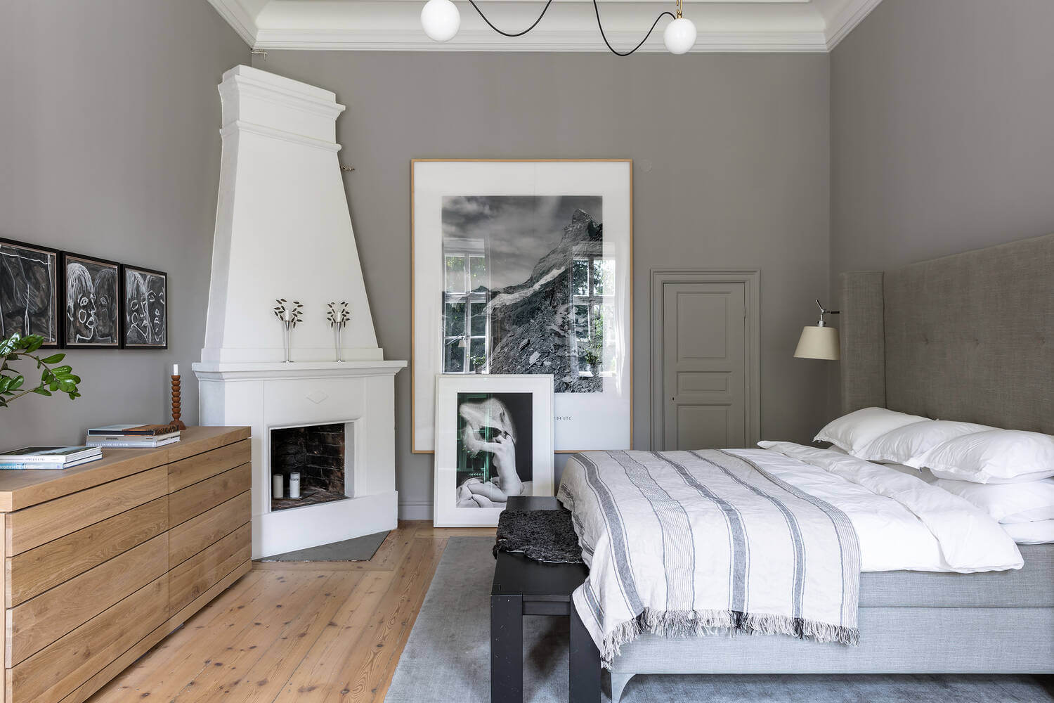 A Stylish Gray Apartment in a Swedish Castle 20 gray-scnandinavian-bedroom-fireplace-nordroom