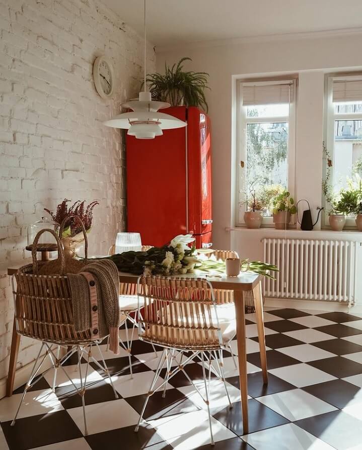 A Warm Scandinavian-Inspired Home in Poland 14 kitchen-black-white-checkerboard-floor-red-smeg-fridge-nordroom