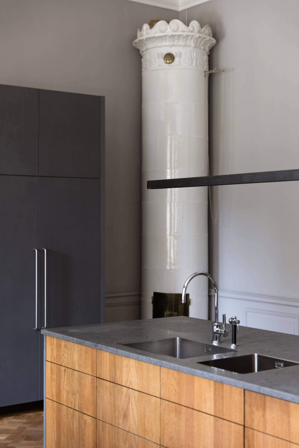 A Stylish Gray Apartment in a Swedish Castle 9 kitchen-island-kakelugn-gray-apartment-sweden-nordroom