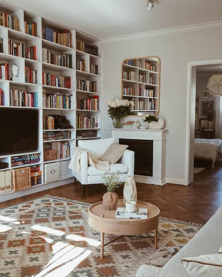 A Warm Scandinavian-Inspired Home in Poland 4 reading-nook-bookshelves-warm-apartment-nordroom
