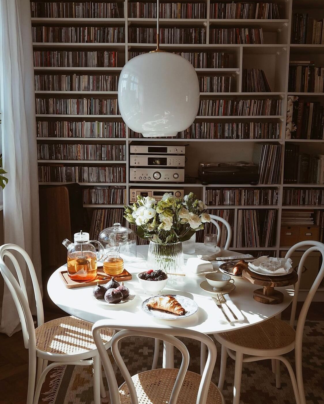 A Warm Scandinavian-Inspired Home in Poland 8 round-dining-table-music-corner-nordroom