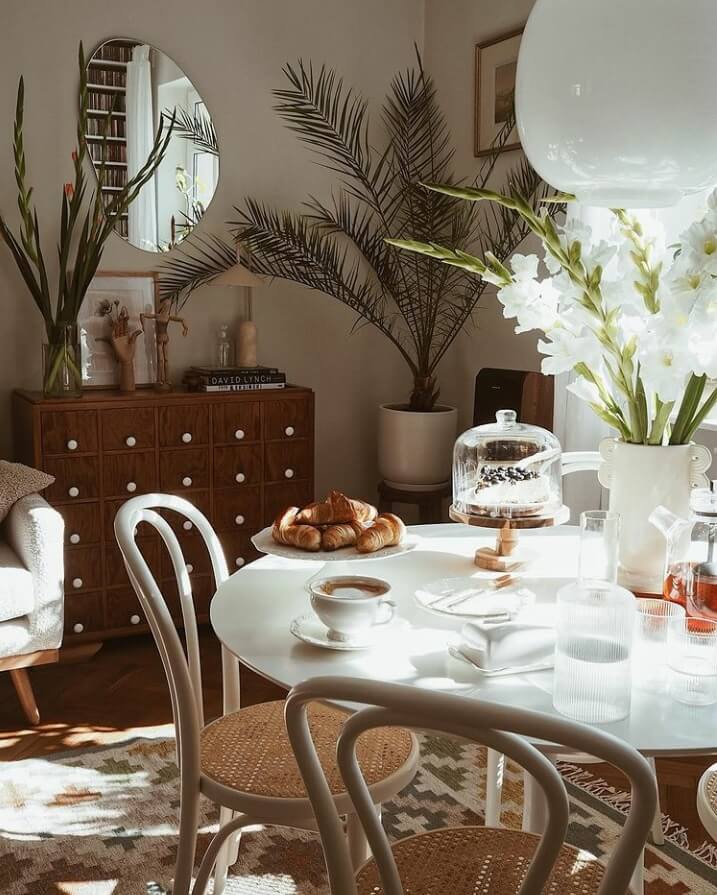 A Warm Scandinavian-Inspired Home in Poland 7 round-dining-table-vintage-cabinet-nordroom