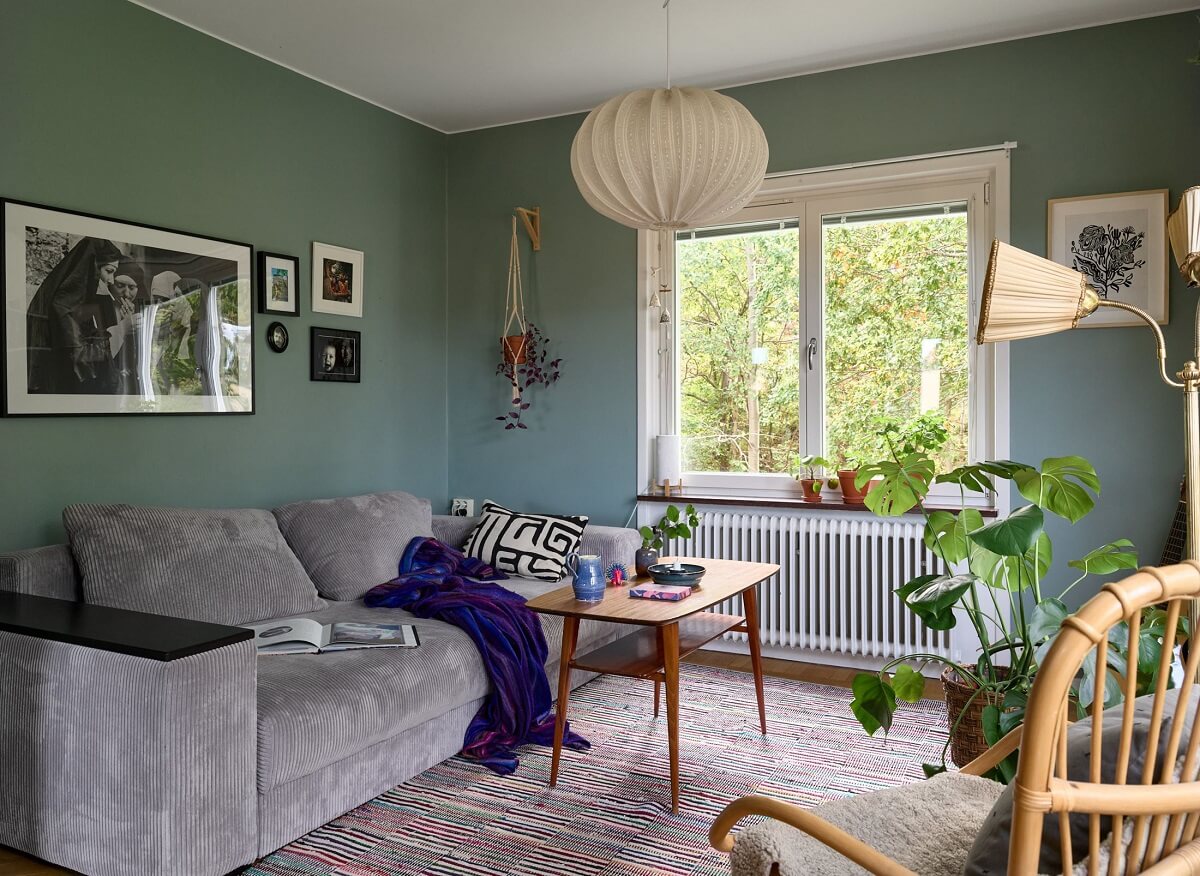 A Natural Scandi Boho Apartment 3 scandinavian-living-room-blue-green-walls-nordroom