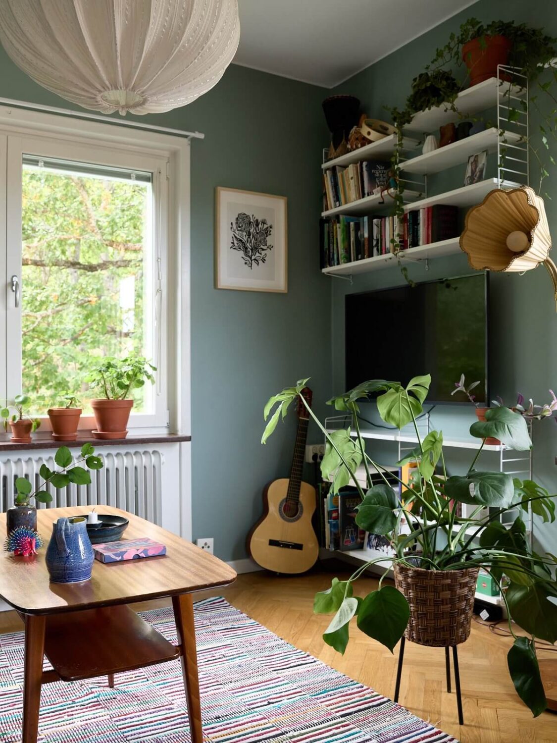 A Natural Scandi Boho Apartment 4 scandinavian-living-room-open-shelves-plants-nordroom