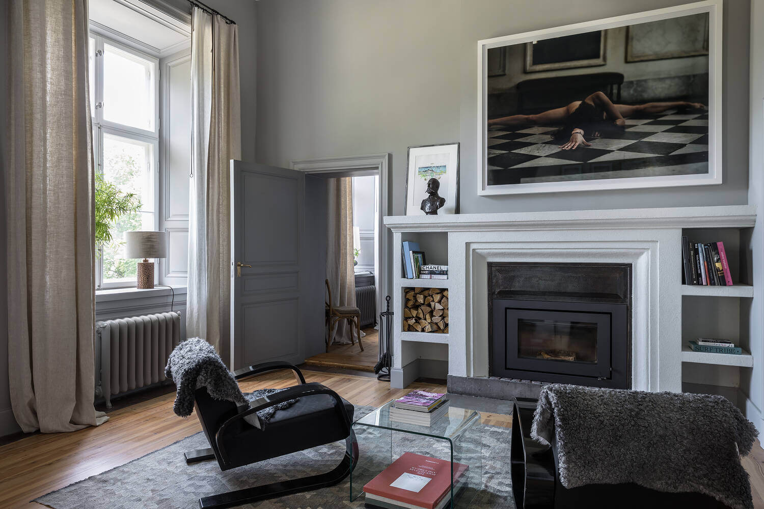 A Stylish Gray Apartment in a Swedish Castle 17 sitting-area-fireplace-castle-conversion-sweden-nordroom
