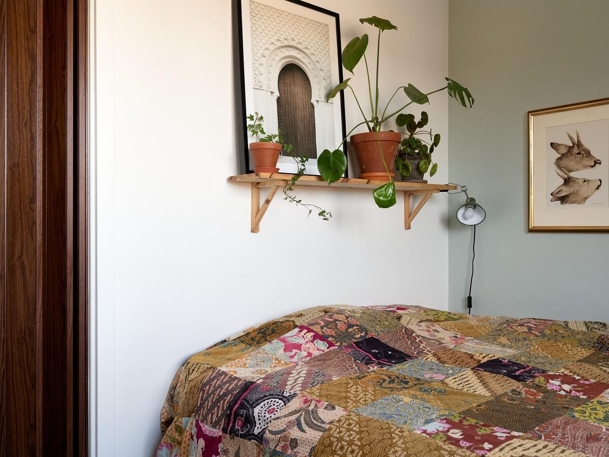 A Natural Scandi Boho Apartment 13 small-bedroom-shelf-plants-blue-green-walls-nordroom