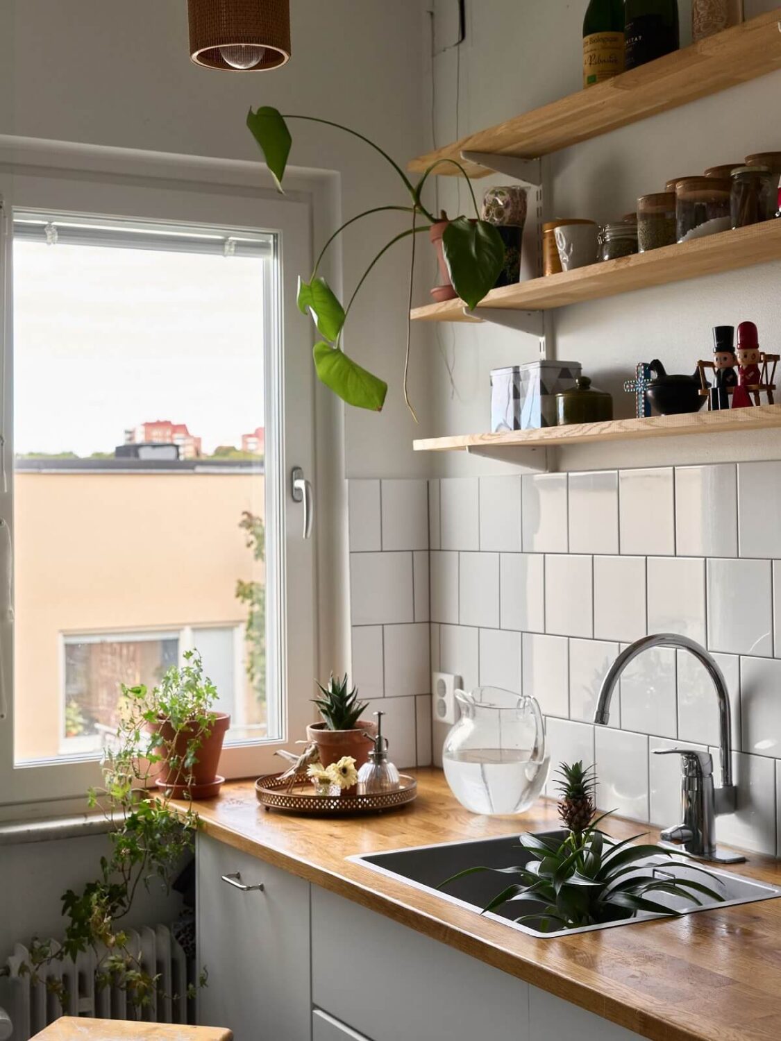 A Natural Scandi Boho Apartment 10 white-kitchen-open-wooden-shelves-scandinavian-interior-nordroom