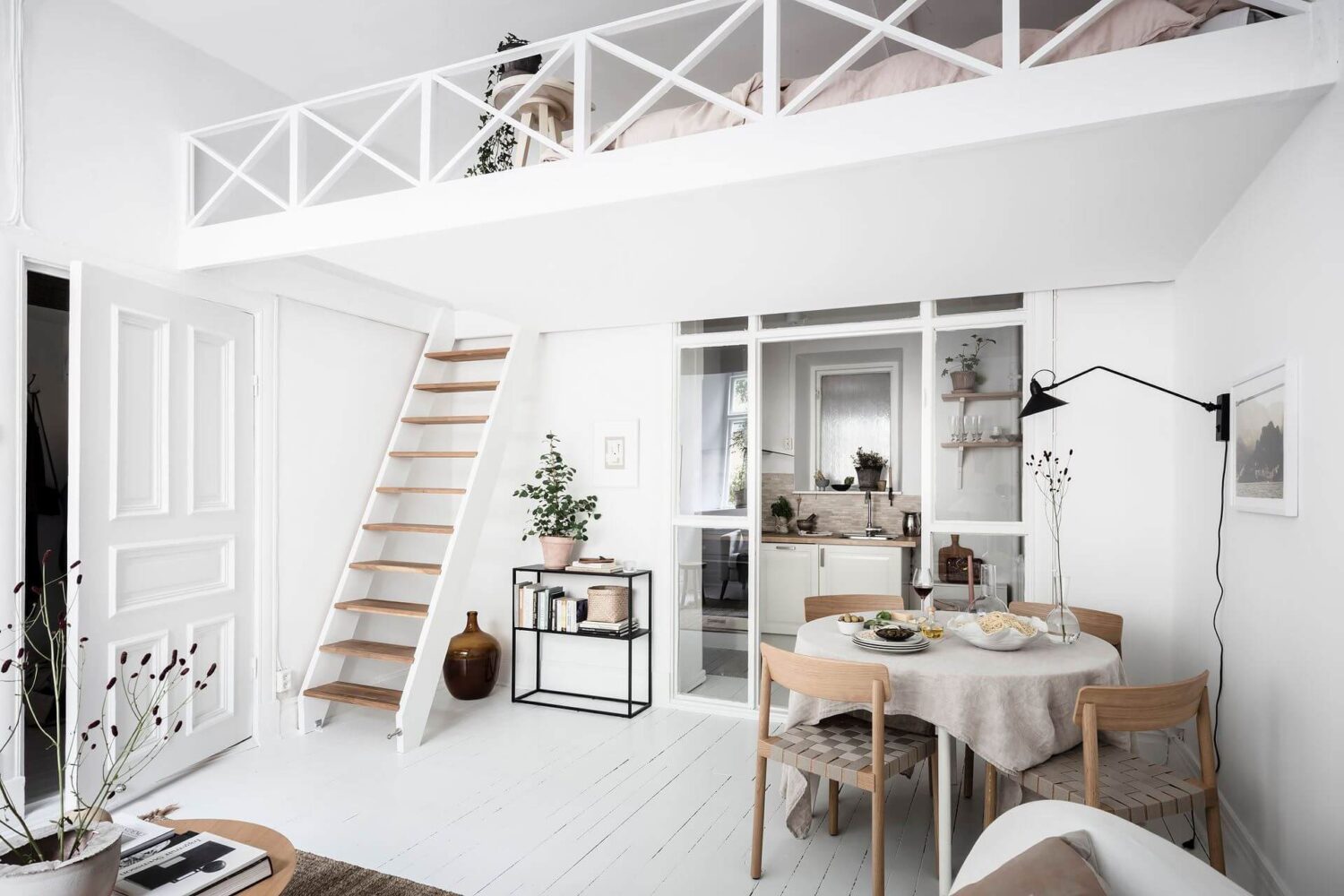 Great Living Room Bedroom Combo Ideas (Layout Tips + Styling) 12 white-scandinavian-studio-apartment-loft-bed-nordroom