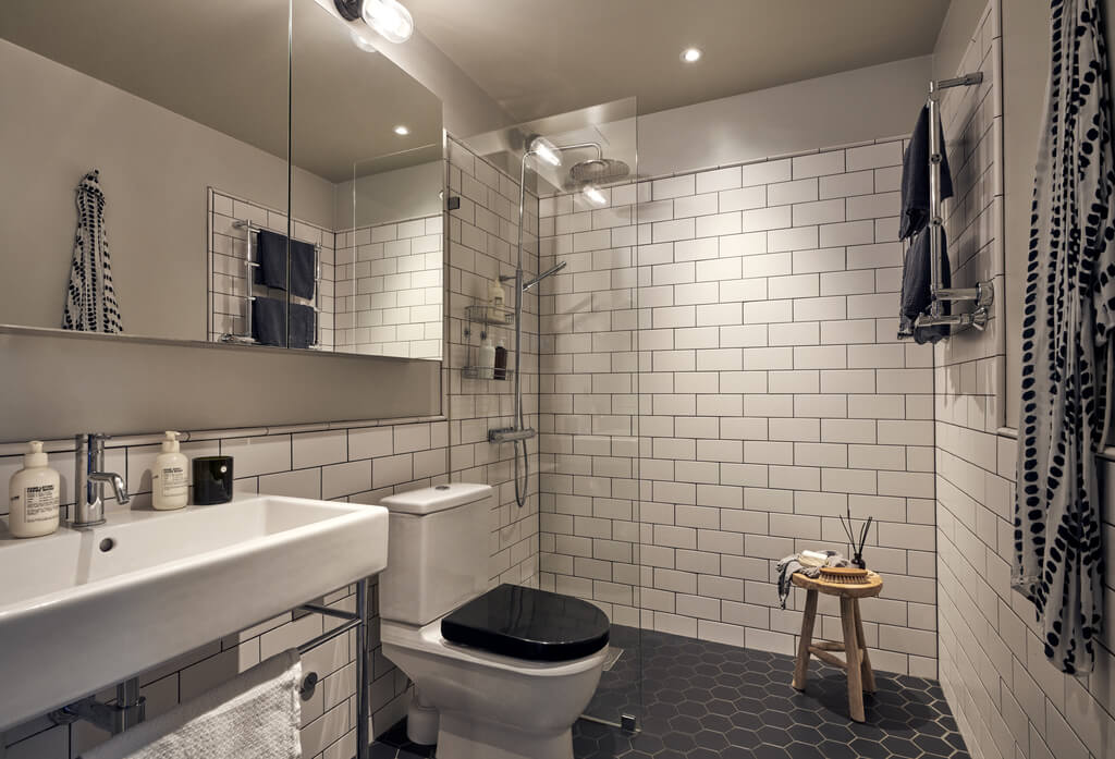 A Swedish Townhouse with Industrial Details 6 bathroom-black-hexagon-tiles-white-subway-tiles-walk-in-shower-nordroom