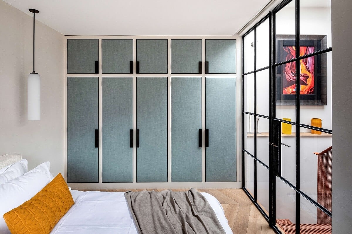 A Modern Playful Mews House in London 10 bedroom-blue-closets-steel-glass-wall-nordroom