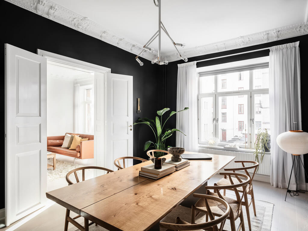 A Black Dining Room in a Stylish Apartment 3 black-scandinavian-dining-room-white-floor-nordroom
